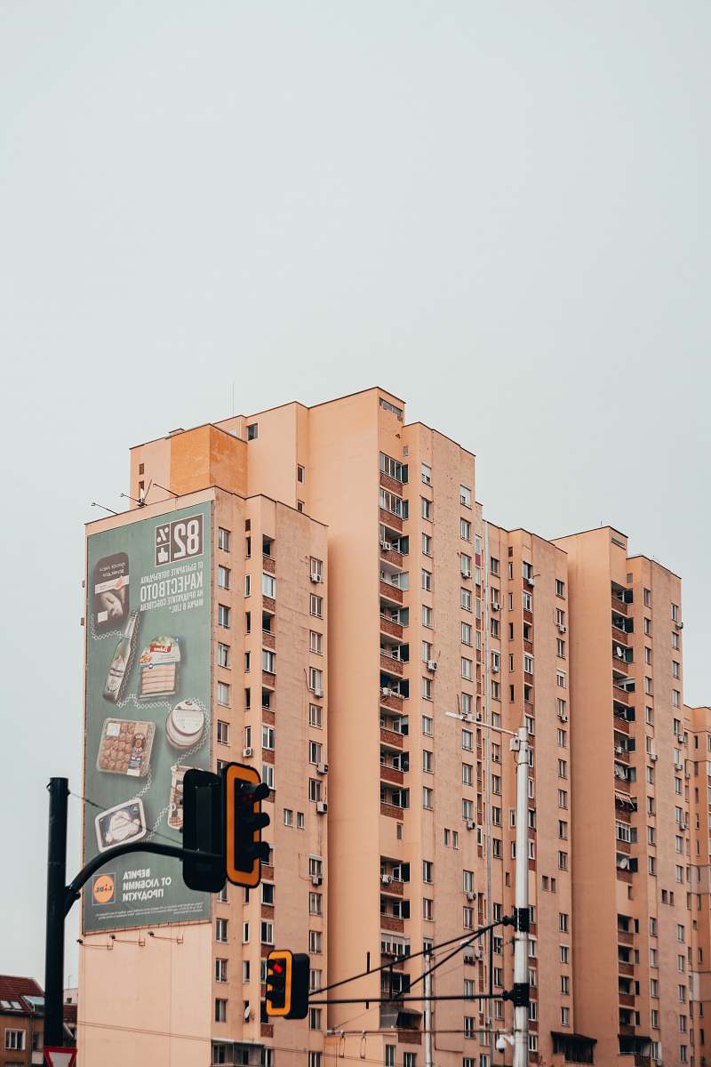 high rise beige concrete building during daytime urban